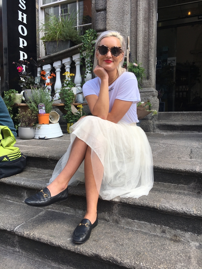 Anouska Proetta is wearing a Missguided skirt with a H&M t-shirt and Gucci shoes. Her glasses are also from Missguided.