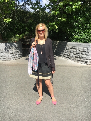 Karolina Kala wears a blazer and skirt that she bought in a charity shop with a top from Vera Moda. Her necklace, shoes and scarf are from Penneys and her handbag is from TK Maxx.