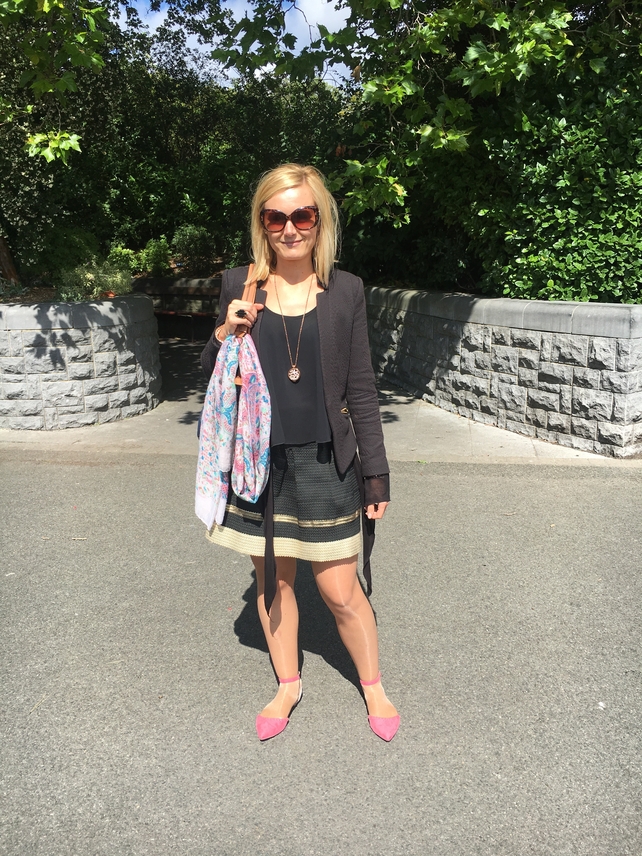 Karolina Kala wears a blazer and skirt that she bought in a charity shop with a top from Vera Moda. Her necklace, shoes and scarf are from Penneys and her handbag is from TK Maxx.