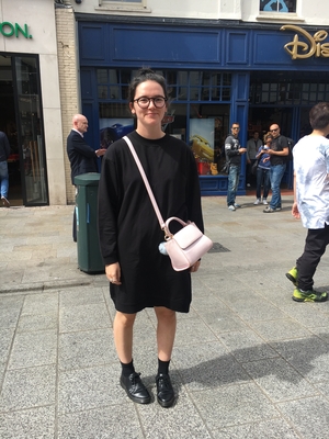 Lucy Mortell wears a black shift dress from Asos.com, boots by Dr. Martens and finishes the look with a bag from Skinny Dip.