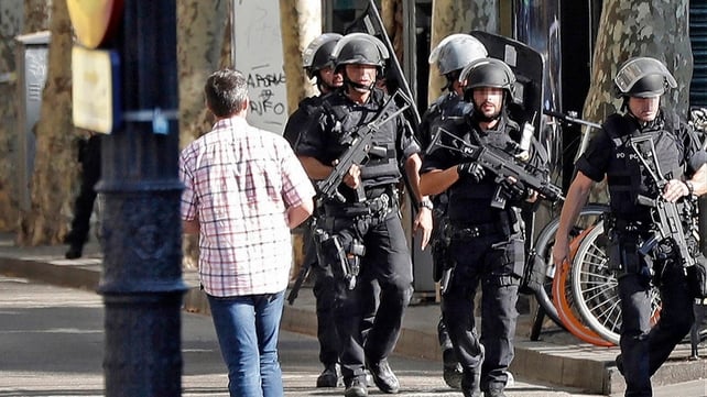 Armed police patrol the streets around the city centre