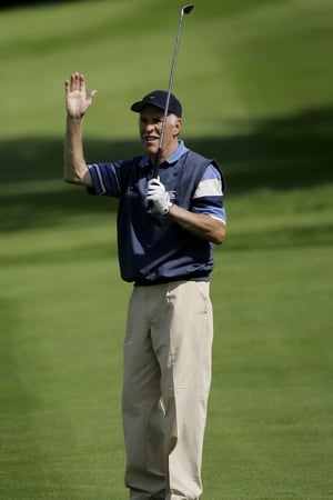Bruce Forsyth acknowledges the crowd on the third hole during the Greensomes Matches of the 2006 Northern Rock All Star Cup