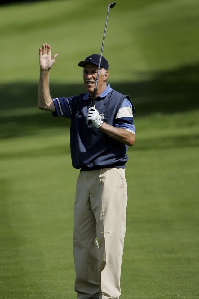 Bruce Forsyth acknowledges the crowd on the third hole during the Greensomes Matches of the 2006 Northern Rock All Star Cup