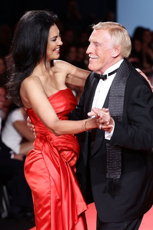 Bruce Forsyth and his wife Wilnelia walk the runway at Fashion for Relief at the Cannes Film Festival on May 16, 2011