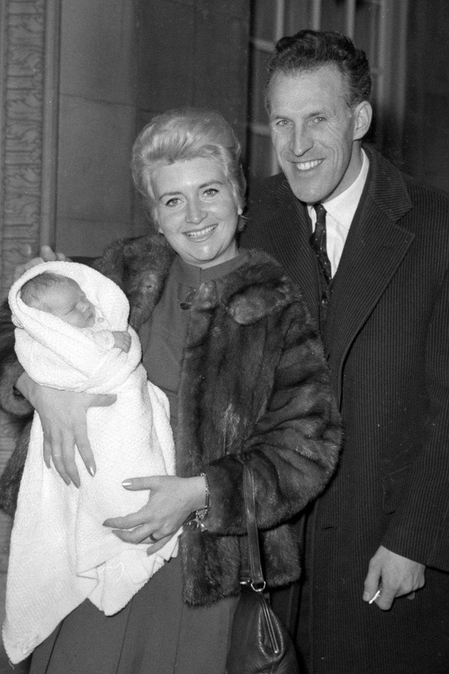Bruce Forsyth escorting his first wife, Penny Calvert, and their new baby, Laura