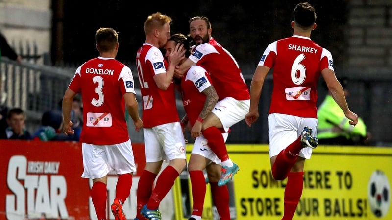 Rhys McCabe mobbed by Sligo teammates after scoring the only goal at Turners Cross