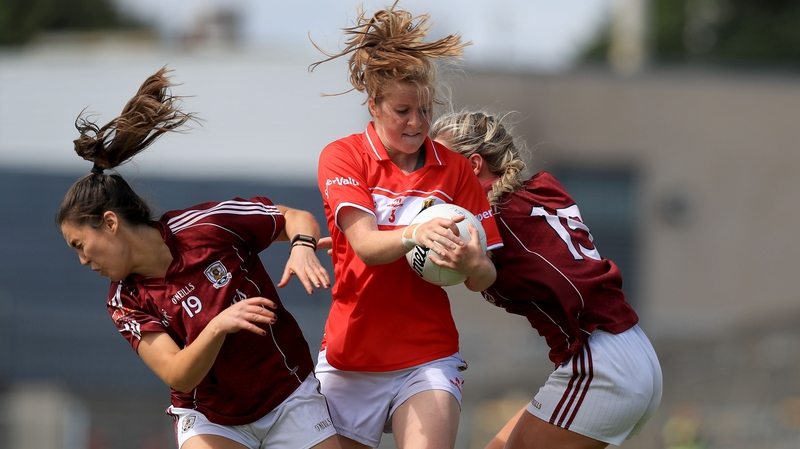 Cork's Roisin Phelan bursts past Deirdre Brennan and Megan Glynn of Galway