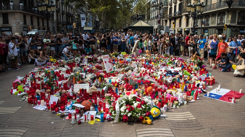 People gather around tributes on Las Ramblas today
