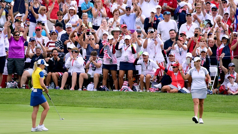Cristie Kerr of Team USA celebrates her putt to win five and three in front of Europe's Jodi Ewart Shadoff