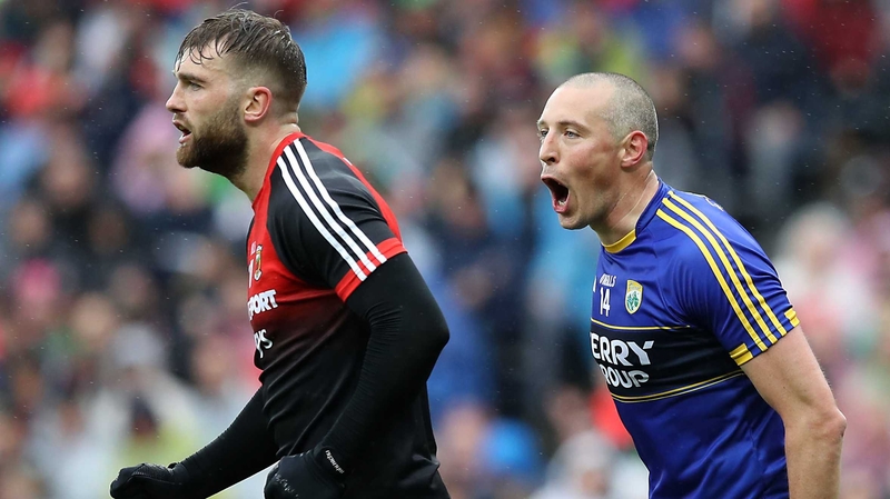 Kieran Donaghy (R) celebrates Kerry's goal in front of Aidan O'Shea