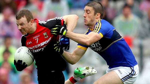 Mayo's Colm Boyle and Stephen O'Brien of Kerry scrap for possession