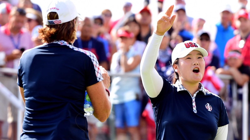 Angel Yin (R) earned the half point USA required to triumph