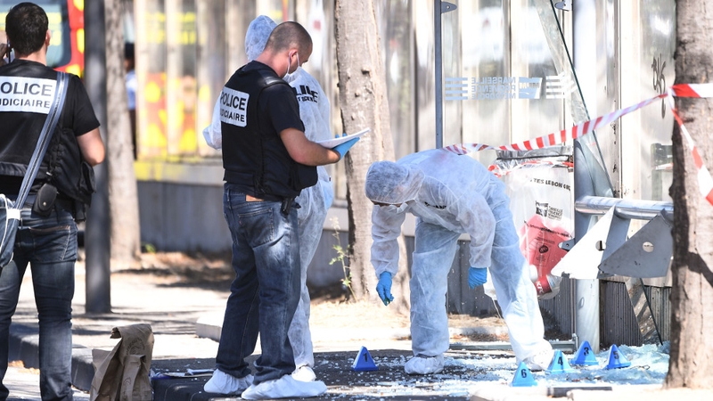 Police and forensic teams at the site of one of the incidents
