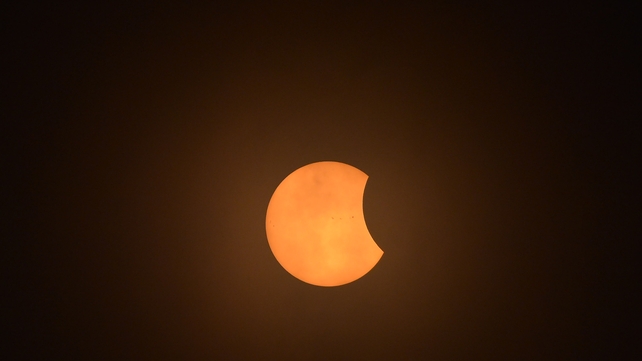 The view from Charleston, South Carolina as the sun begins to go behind the moon