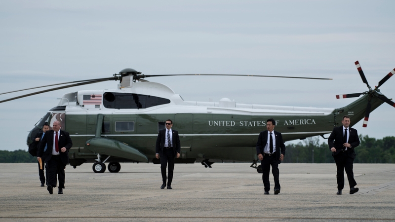 Members of the Secret Service arrive to board Air Force One to escort Donald Trump at Andrews Air Force Base in May