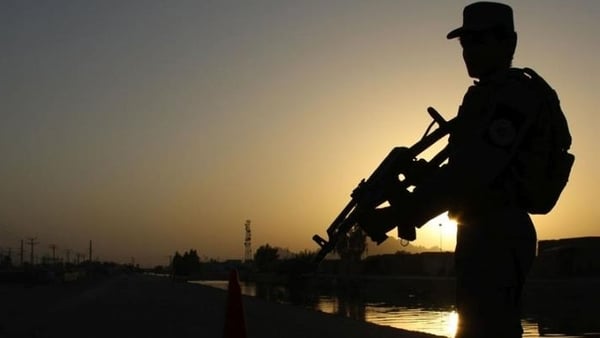 Afghan Police stand guard on a highway leading to Shah Wali Khan district, in Kandahar. Photo: EPA/Muhammad Sadiq