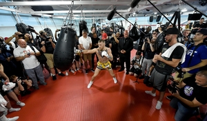 McGregor hits a heavy bag during a media workout at the UFC Performance Institute in Las Vegas of August this year.
