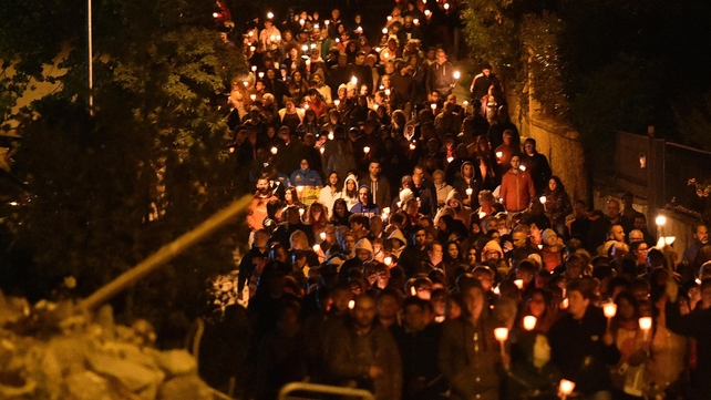 Residents held a silent candlelit march, which wound its way through streets of the devastated town