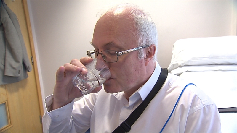 Fergal Bowers swallows the flashing pill camera with water