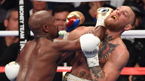 Mayweather and McGregor in action