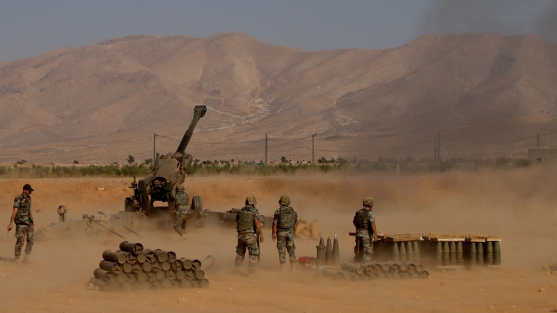 Lebanese soldiers bombarding Islamic state fighters near the Lebanese Syrian border