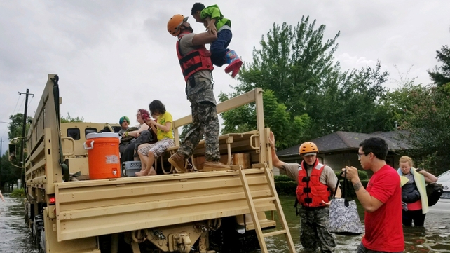 Texas National Guard soldiers help people in heavily flooded areas of Houston