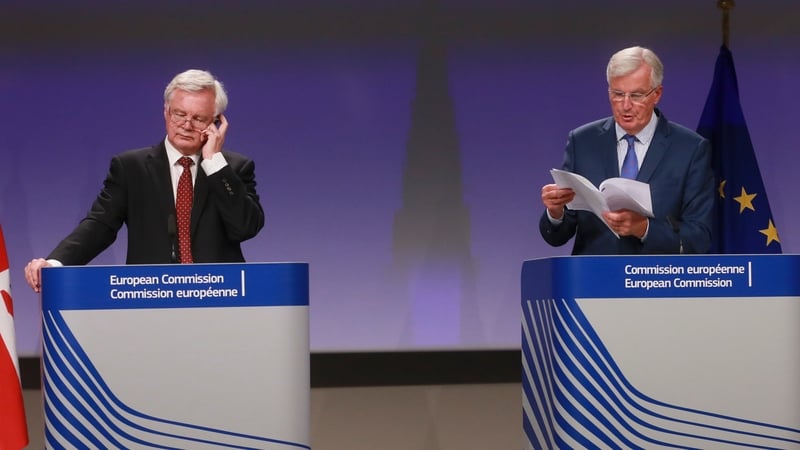 EU's chief negotiator Michel Barnier (R) and his British counterpart David Davis speaking at a joint news conference