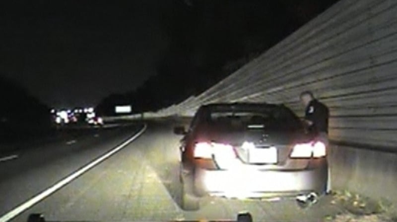 Dash cam video showed the Cobb County police officer standing by a car pulled over alongside a road