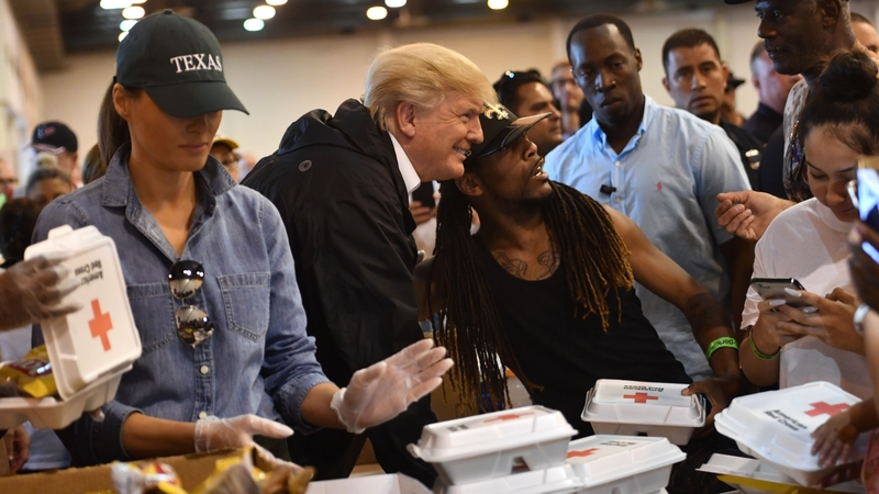 Donald and Melania Trump serve food at an emergency shelter in Houston today
