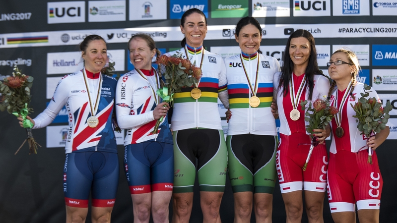 Katie-George Dunlevy and Eve McCrystal stand atop the podium after their second gold medal win