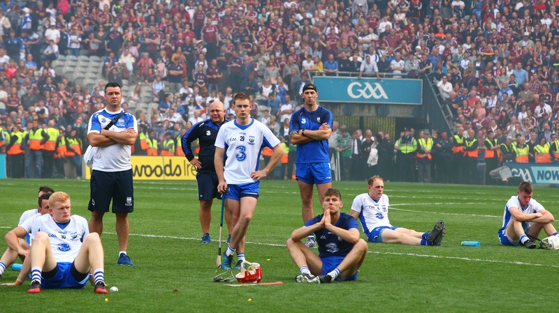 A dejected Derek McGrath with his players and selector Dan Shanahan after the match