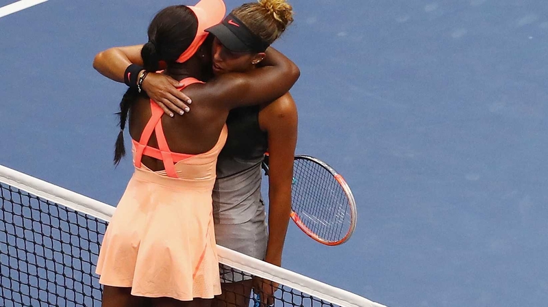 Sloane Stephens (l) of the United States hugs Madison Keys