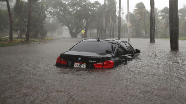 A car is seen on a flooded street as Hurricane Irma passes through