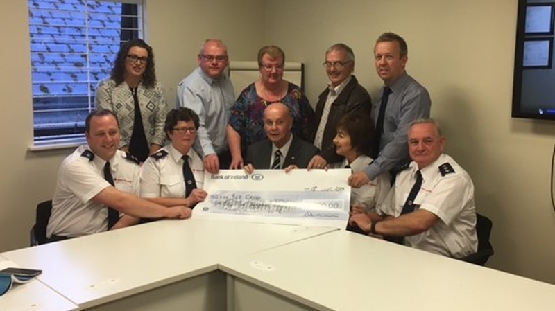 Cheque handed over to Red Cross representatives