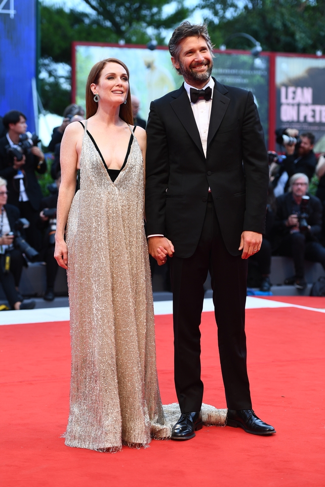 Julianne Moore and Bart Freundlich walk the red carpet ahead of the 'Suburbicon' screening. Julianne wore a beautiful beaded Valentino gown.
