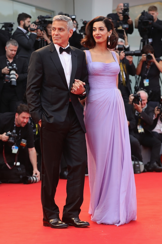 George Clooney and Amal Clooney walk the red carpet ahead of the 'Suburbicon' screening. Amal stunned in this lilac Atelier Versace gown