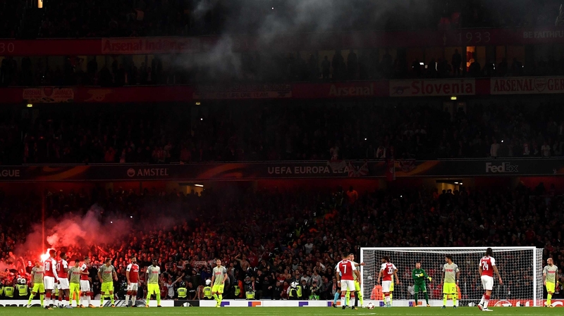 Cologne fans let off flares after Jhon Cordoba's goal at the Emirates