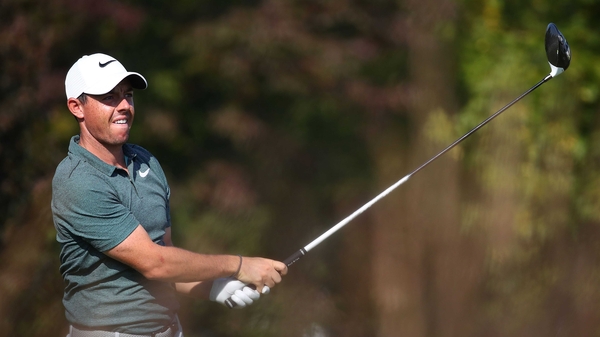 Rory watches his tee shot off the fourth