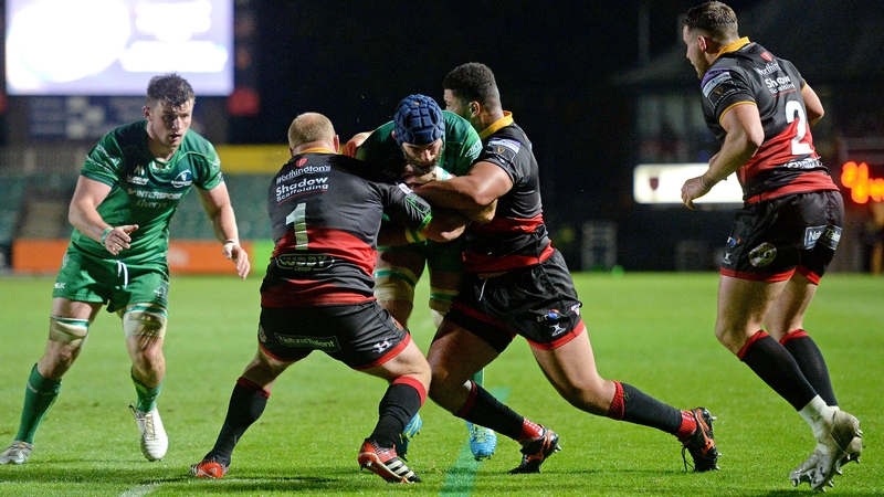 John Muldoon is tackled by Leon Brown and Brok Harris