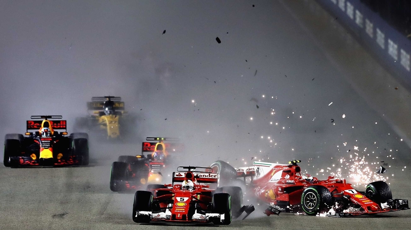 Sebastian Vettel of Germany driving the (5) Scuderia Ferrari SF70H and Kimi Raikkonen of Finland driving the (7) Scuderia Ferrari SF70H collide