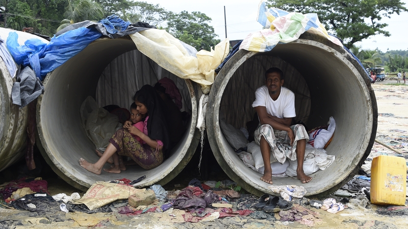 Rohingya refugees shelter in cement pipes at a refugee camp in Bangladesh
