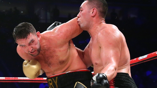 Joseph Parker lands a left shot on Hughie Fury (l)