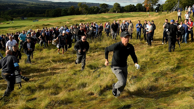 Rory McIlroy runs to the 17th green during day one of the British Masters