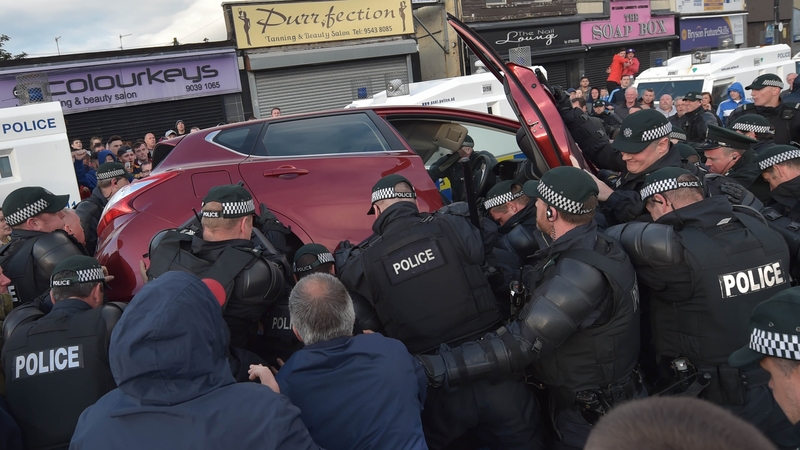 Mr Aughey claimed he made a U-turn as he believed his car had come under attack by protesters