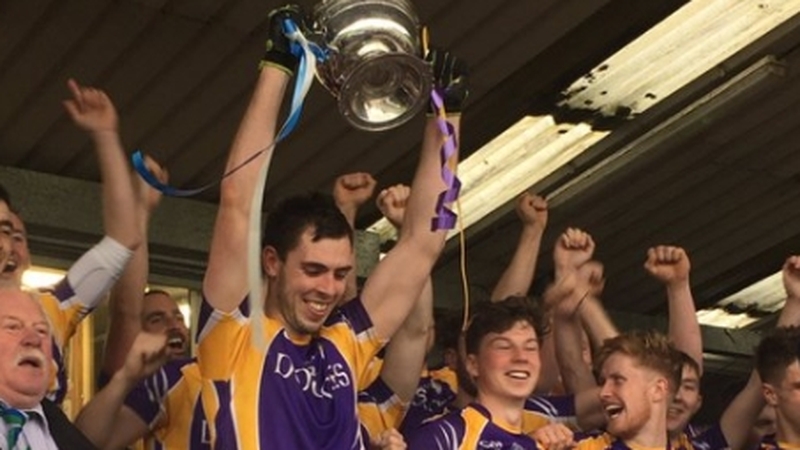 Ryan Jones lifts aloft the county title, their third successive senior championship