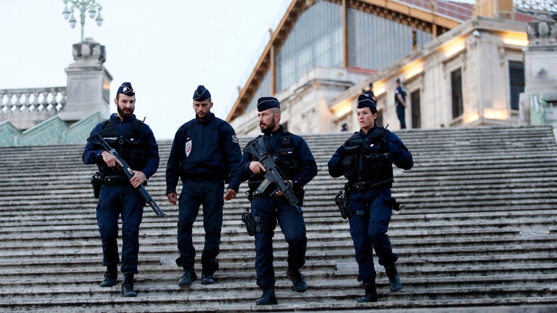 Police offciers stand guard at the train station in Marseille