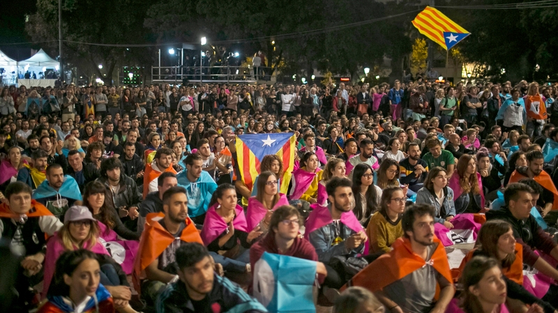 Hundreds of people celebrate after the Catalonia independence referendum in Barcelona, Spain