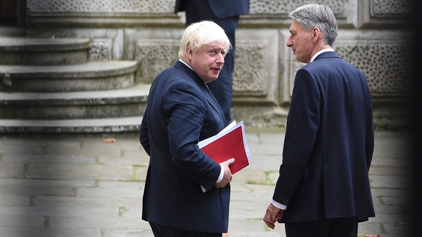 Philip Hammond (r) said Theresa May deserves backing from her ministers