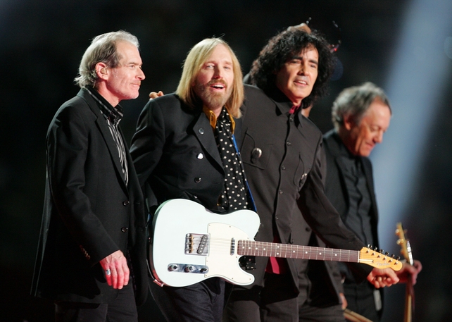 Back to black. Benmont Tench, Tom Petty, Mike Campbell and Scott Thurston are co-ordinated in black as they perform at the Bridgestone halftime show during Super Bowl XLII in 2008