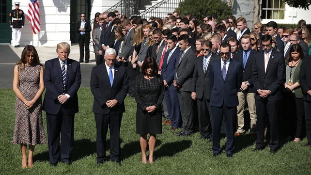 US President Donald Trump held a minute's silence at the White House alongside First Lady Melania Trump, Vice President Mike Pence and Second Lady Karen Pence